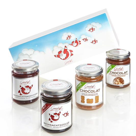 Sie sehen ein 4er Konfitürenpräsent mit fliegenden Weihnachtsmännern